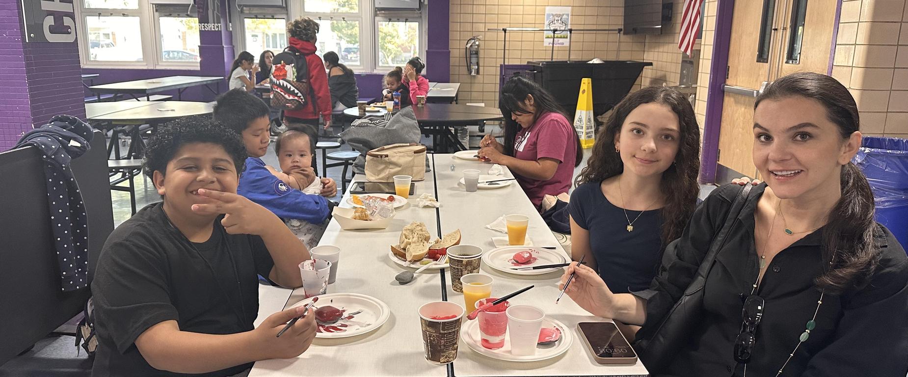 students and families at table