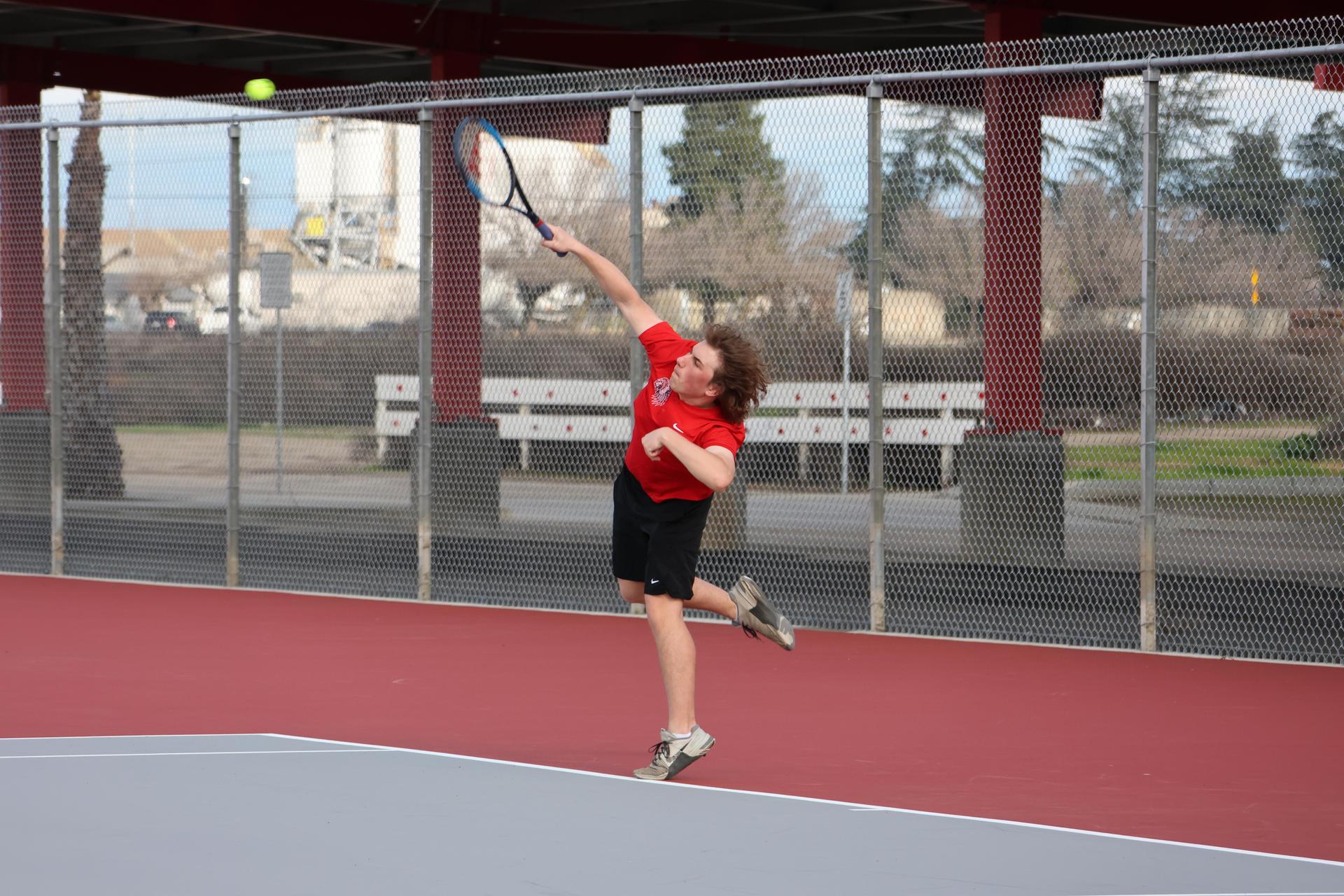 CUHS Boys playing tennis against coalinga