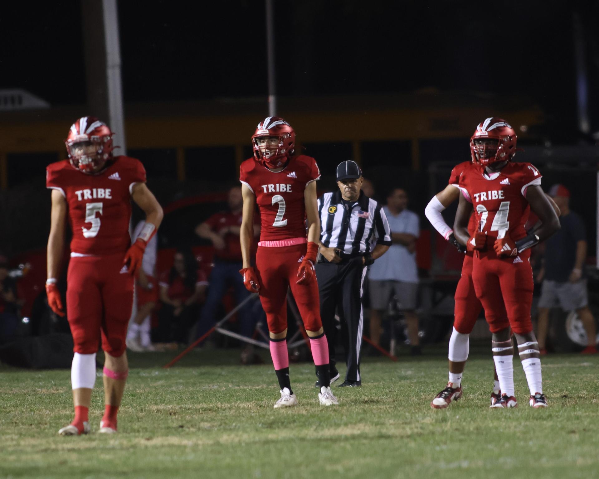 varsity boys playing football against Fowler