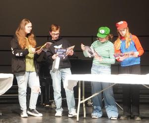 Students practice scene from the show.