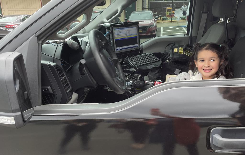 student in police truck