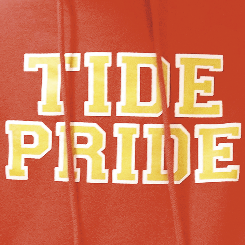 Closeup of a red sweatshirt with the words "Tide Pride" on the fron