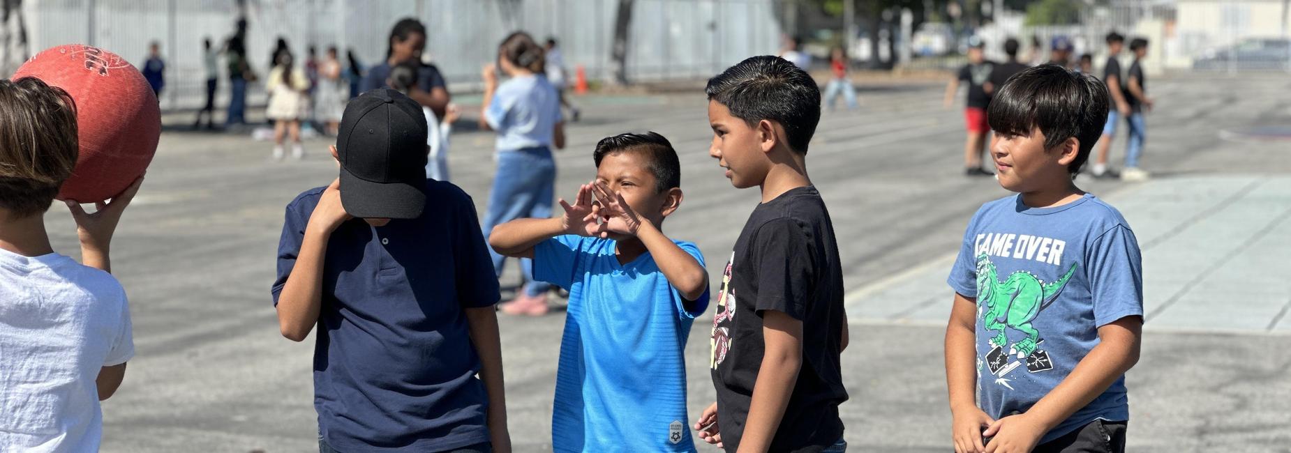 Students playing handball at recess