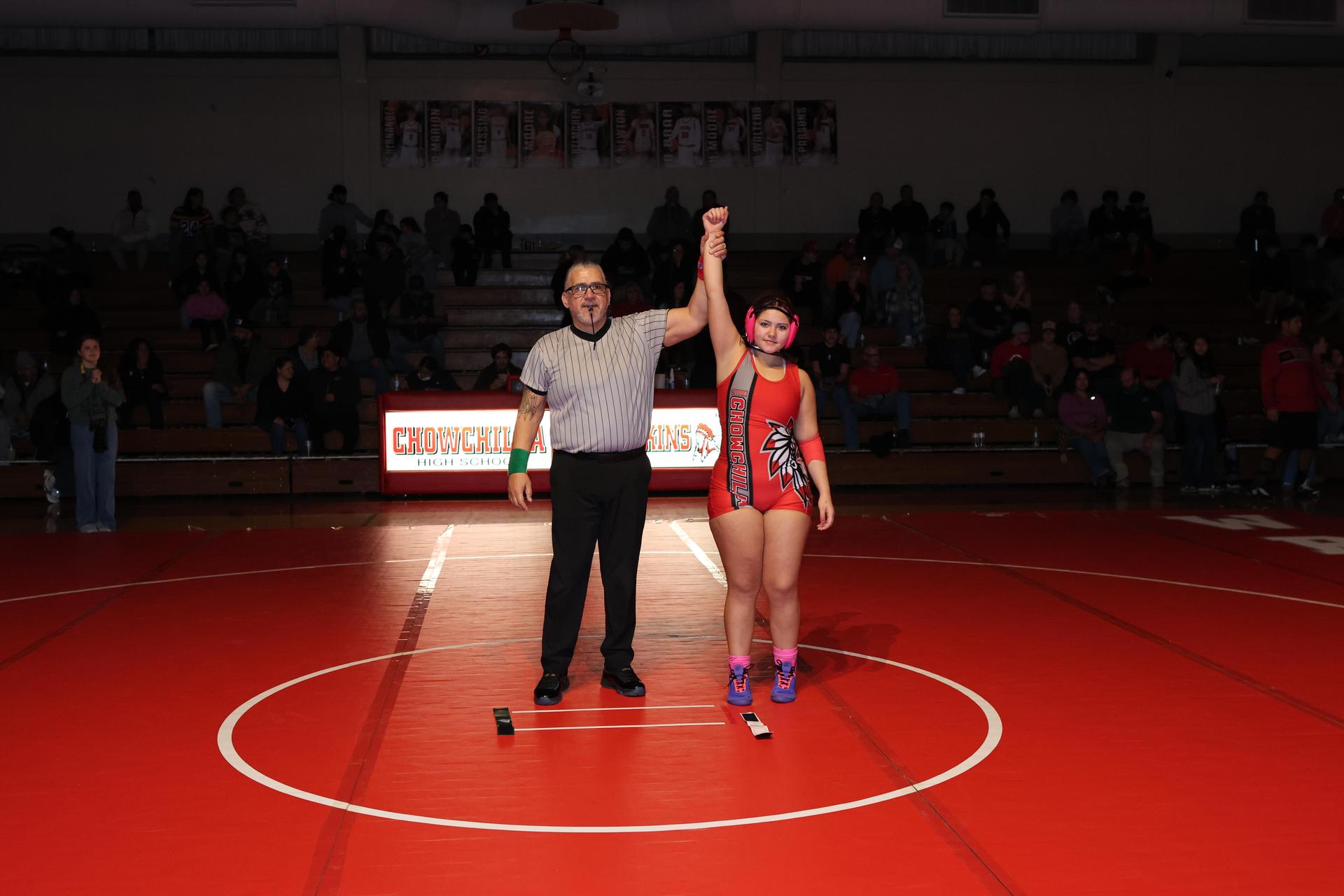 Wrestling winners with hands up 107