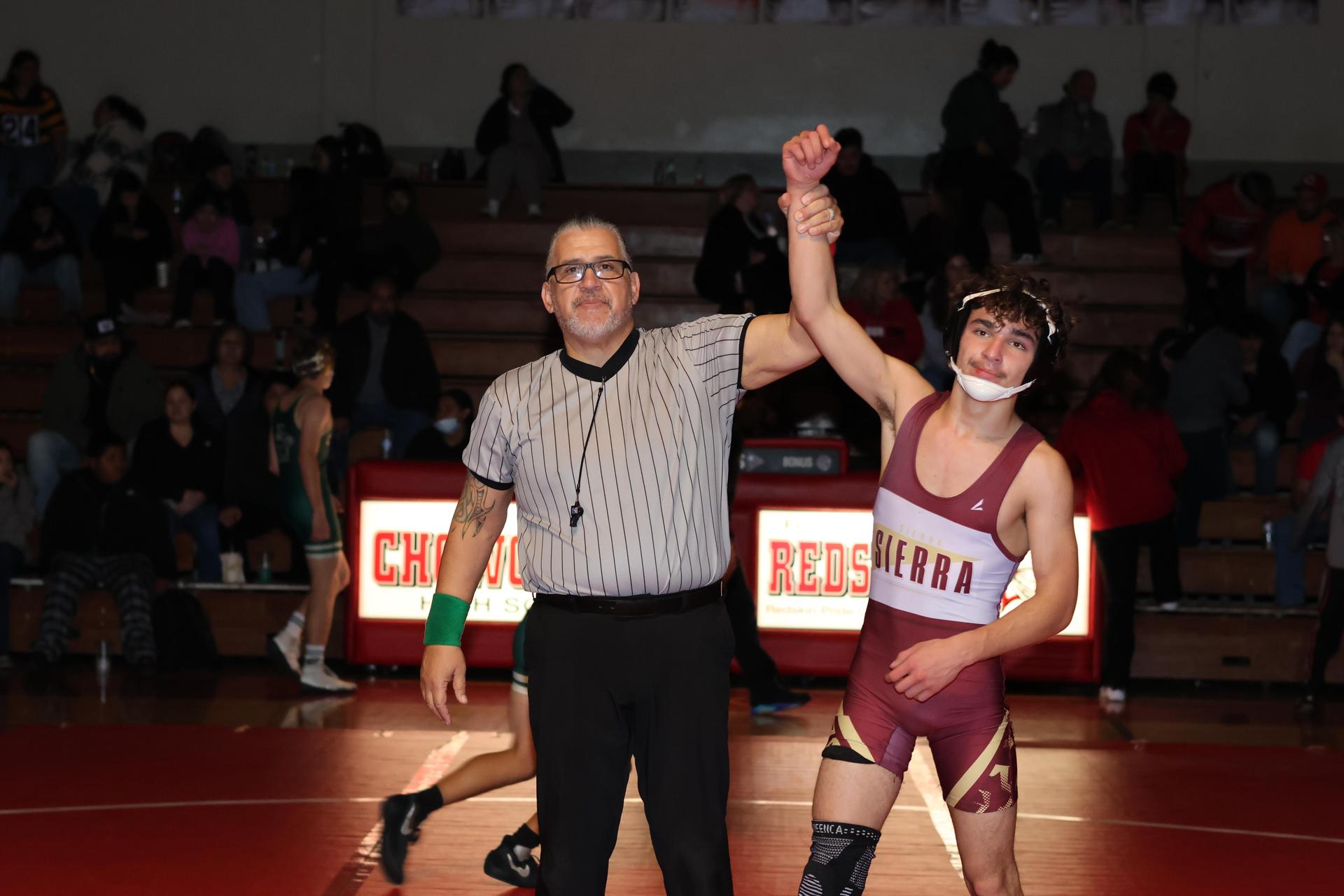 Wrestling winners with hands up 60