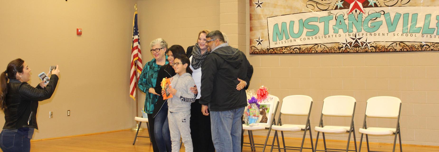 Joaquin with family and school board members