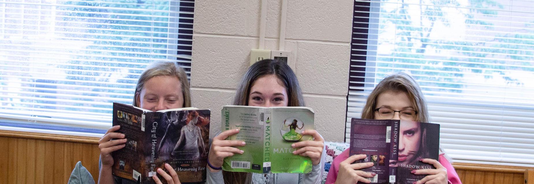 Three students reading
