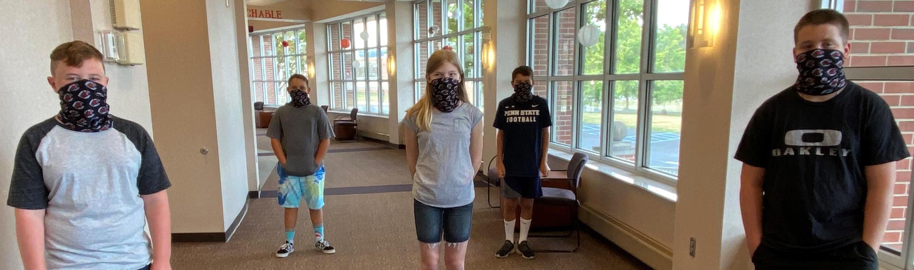 SCMS students wearing gaiters donated by the Dragon Pride Foundation