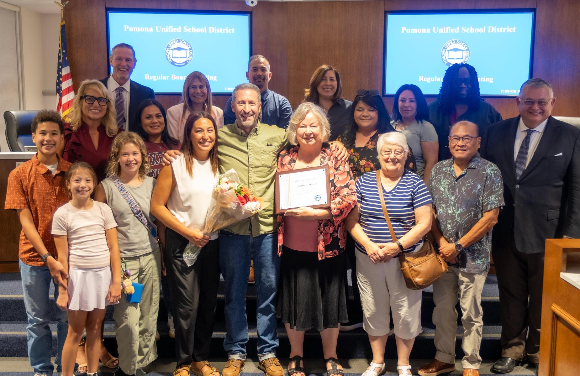Board meeting photo with Teacher of the year at Pomona Unified School District. - image needed for shuffle banner