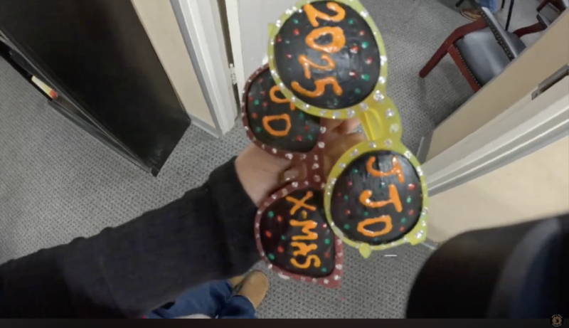 sunglasses with JJD 2025 on the lenses