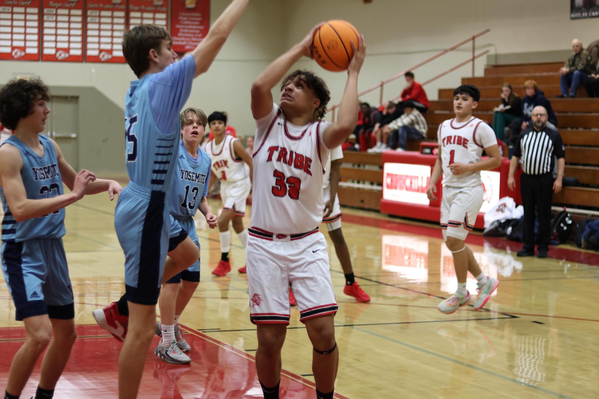 junior varsity boys playing basketball against yosemite