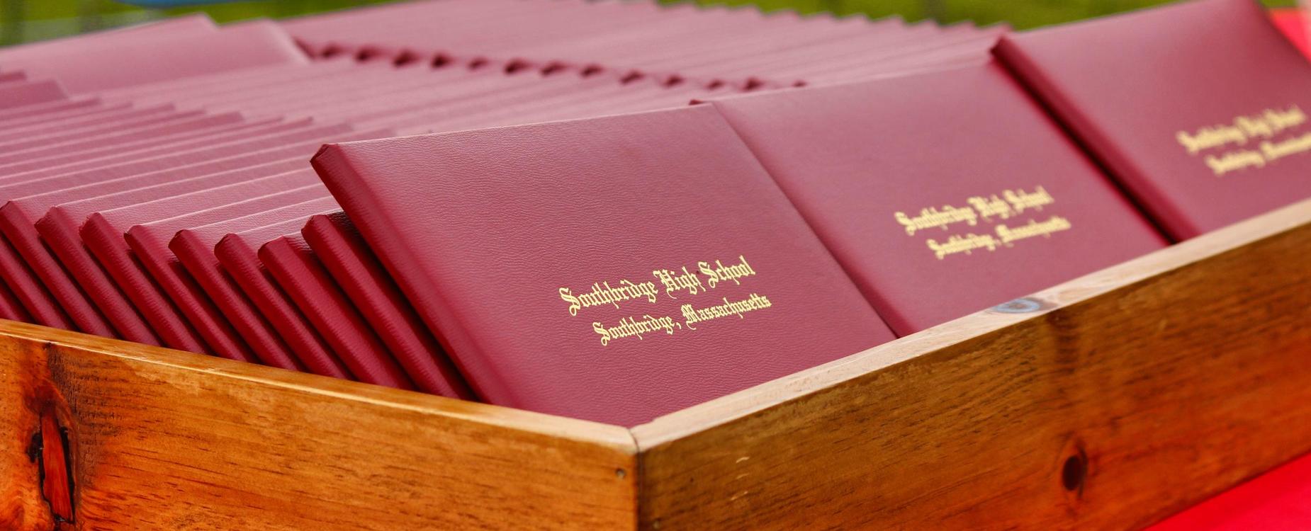 A tray of diplomas at a Southbridge High School graduation