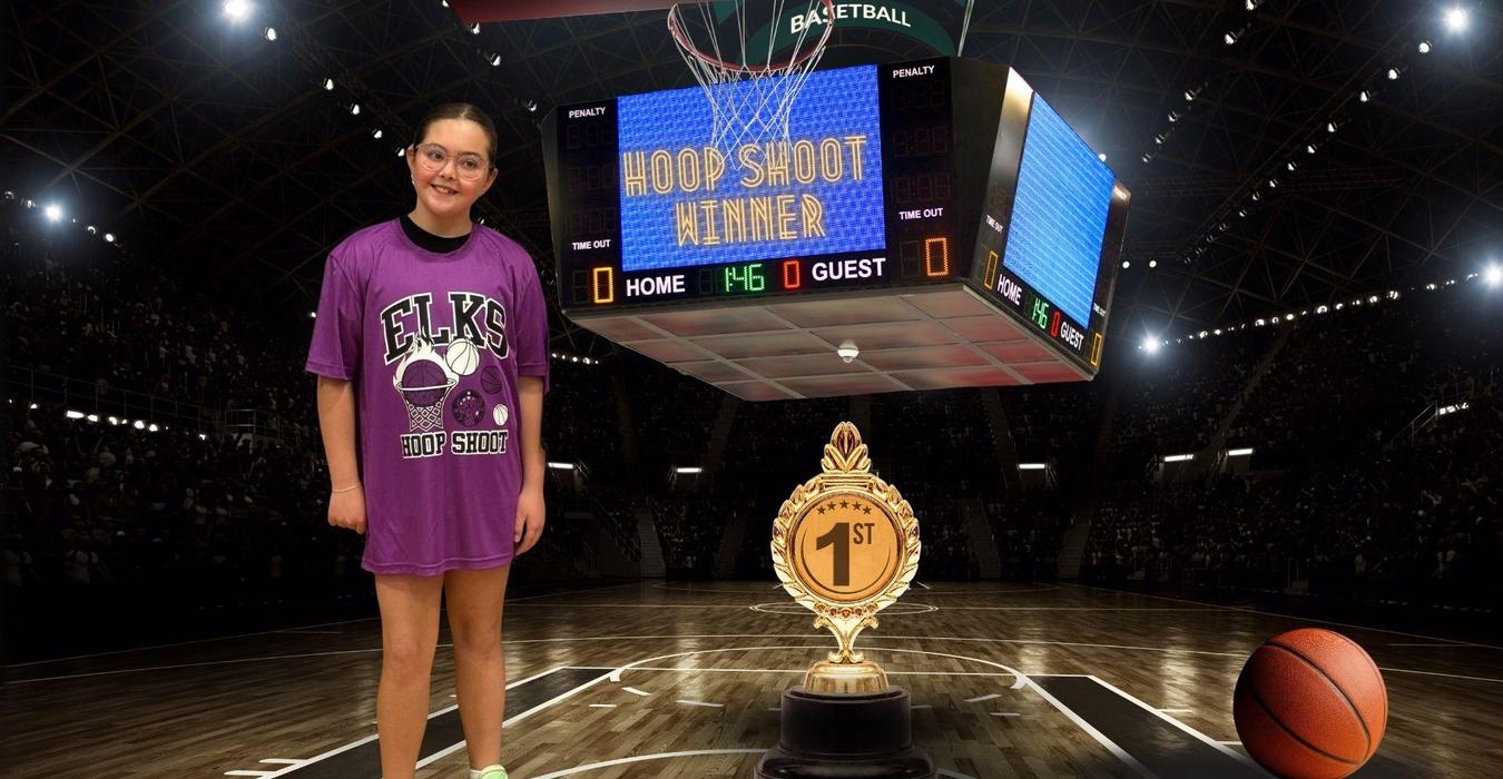 A young girl in a purple shirt stands proudly with a trophy on a basketball court.