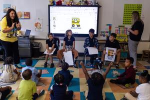 Fifth graders visit a kindergarten classroom