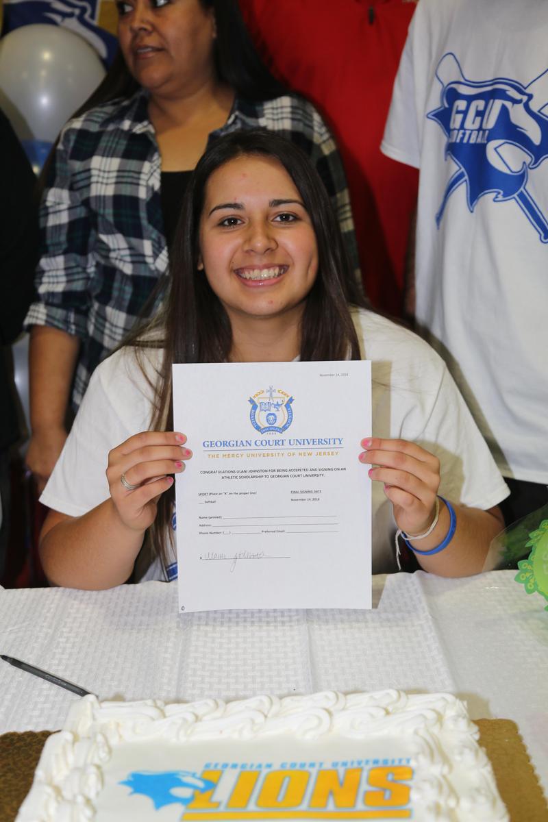 Ulani Johnston holding her Letter of Intent