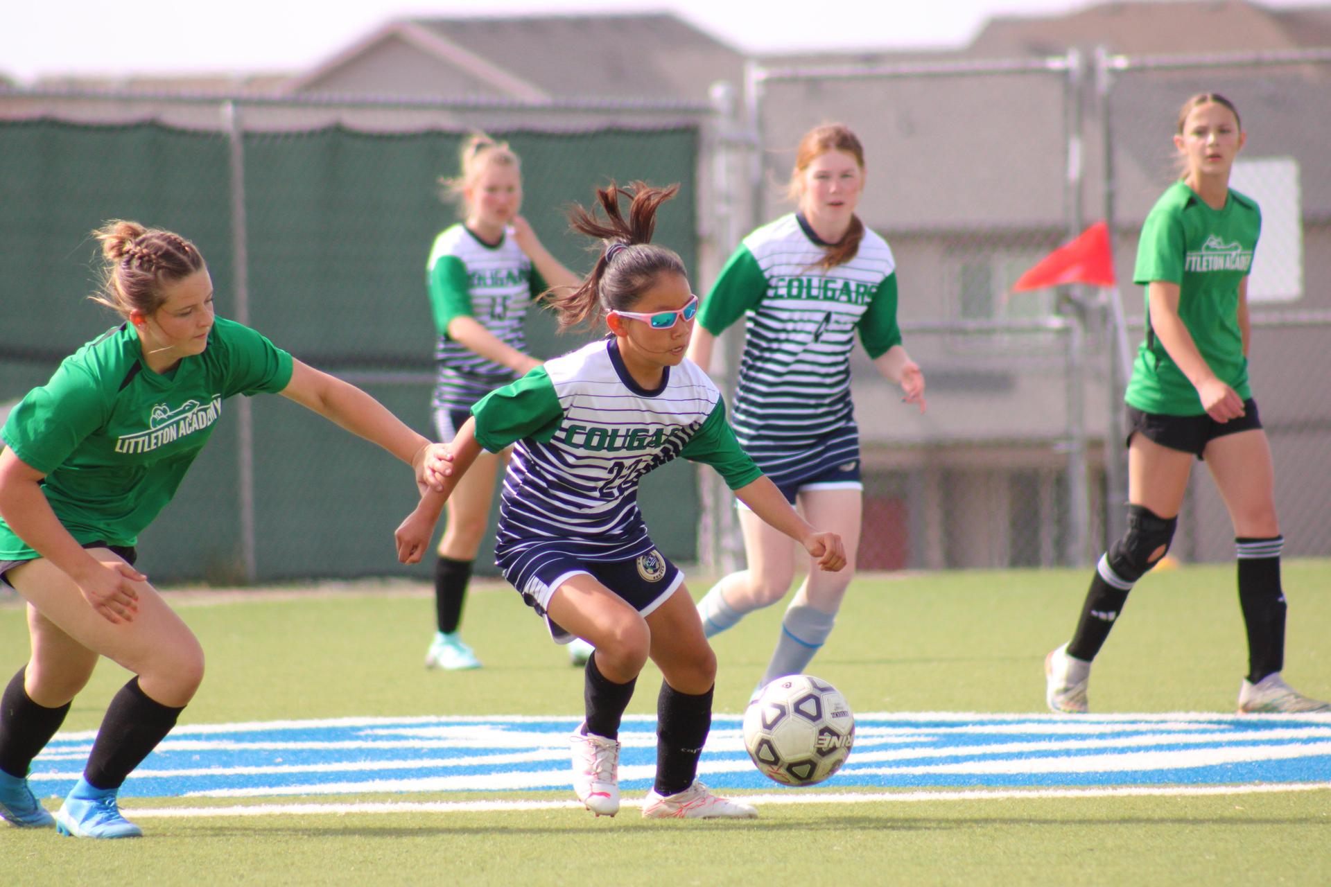 PCK Girls Soccer Player Handles Ball Against Littleton