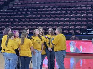 another picture of the students singing on the court