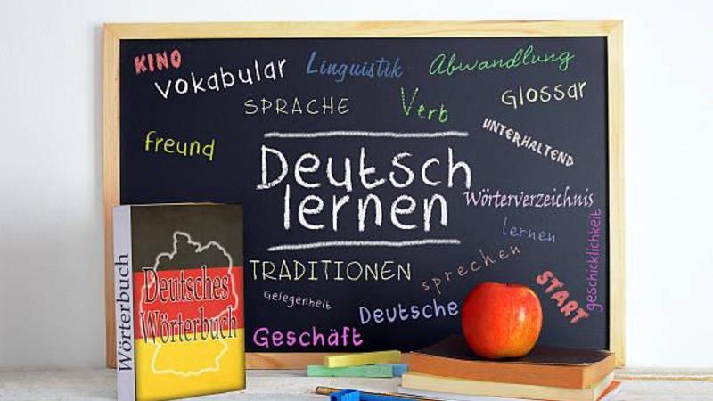 Chalkboard with instructions to learn German