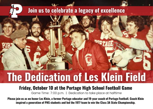 Group of football players celebrating with a trophy at a dedication event.