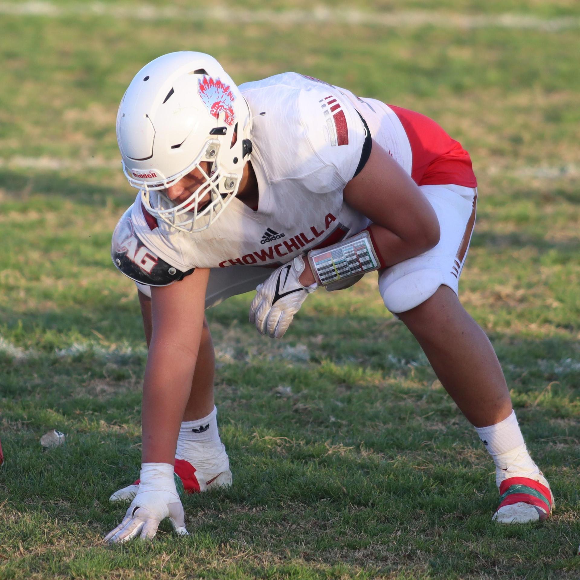 Junior Varsity football players in action against Caruthers