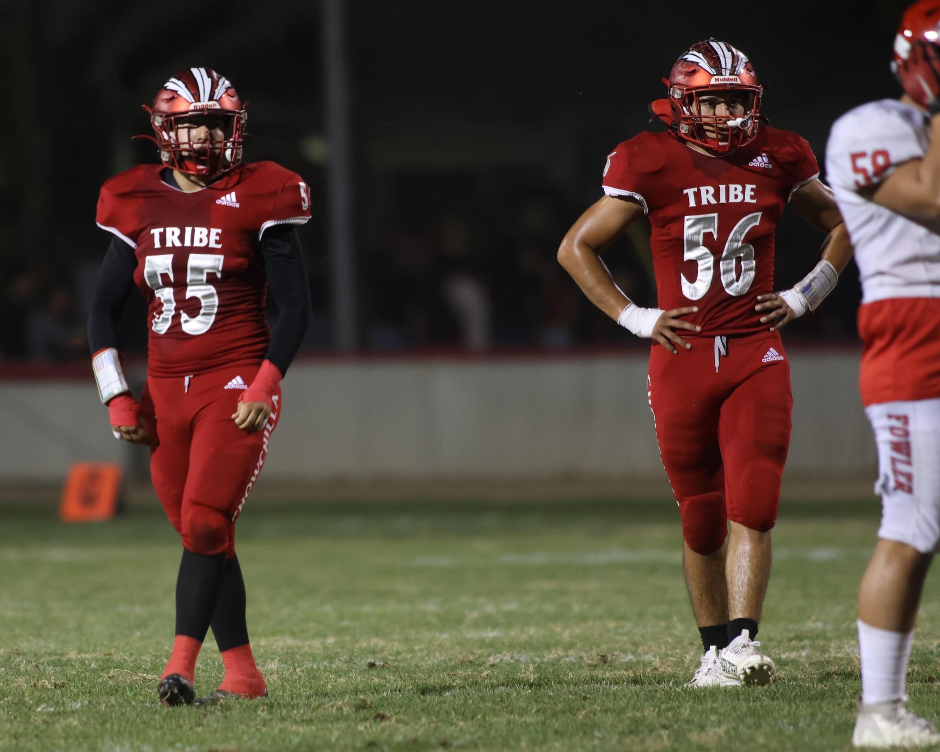 varsity boys playing football against Fowler
