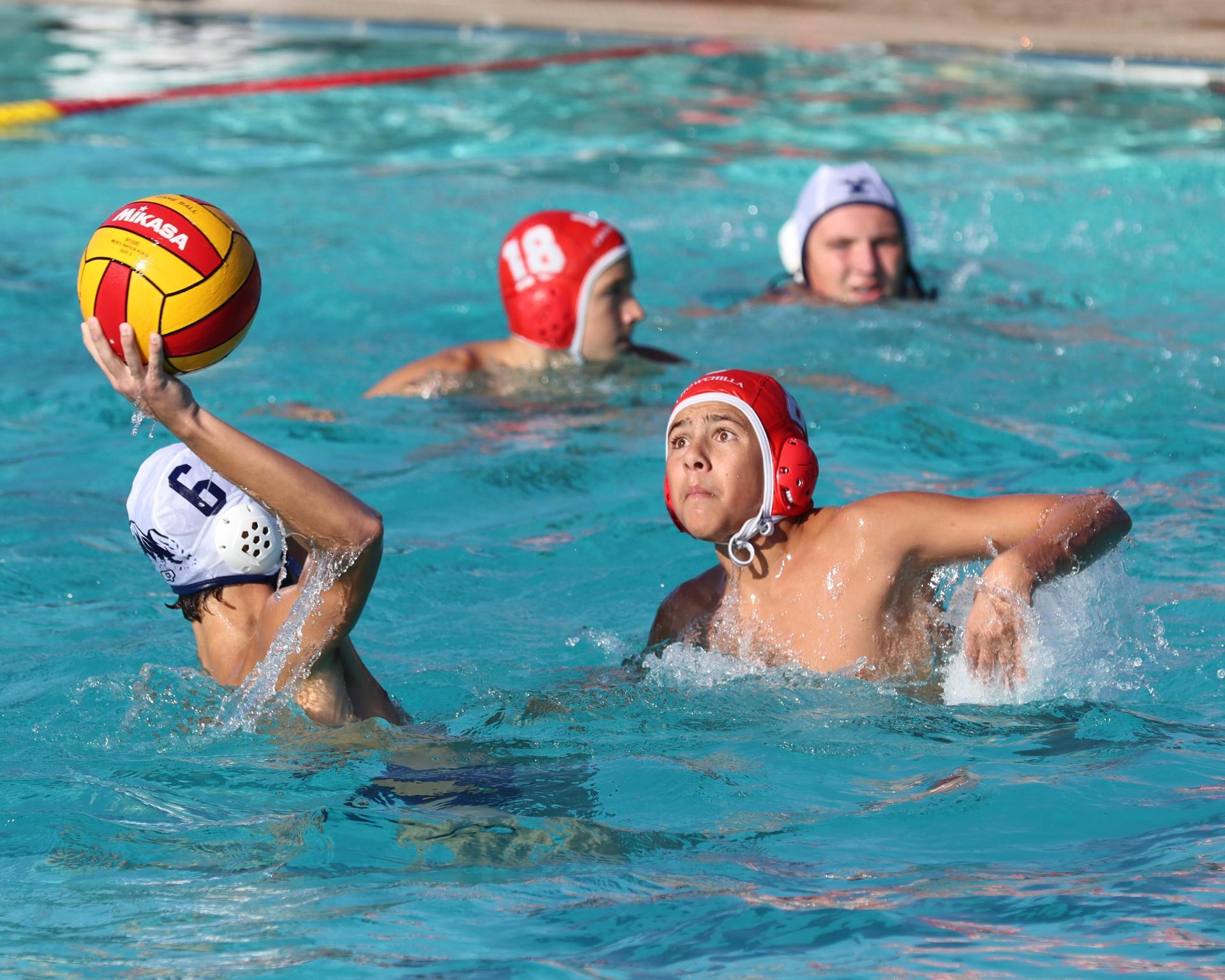 Boys playing water polo against Yosemite