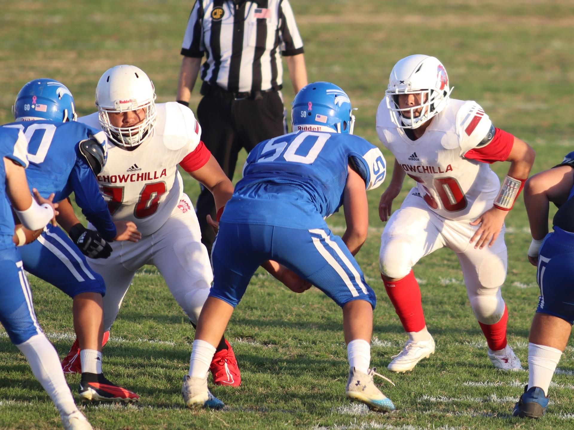 Junior Varsity football players in action against Caruthers