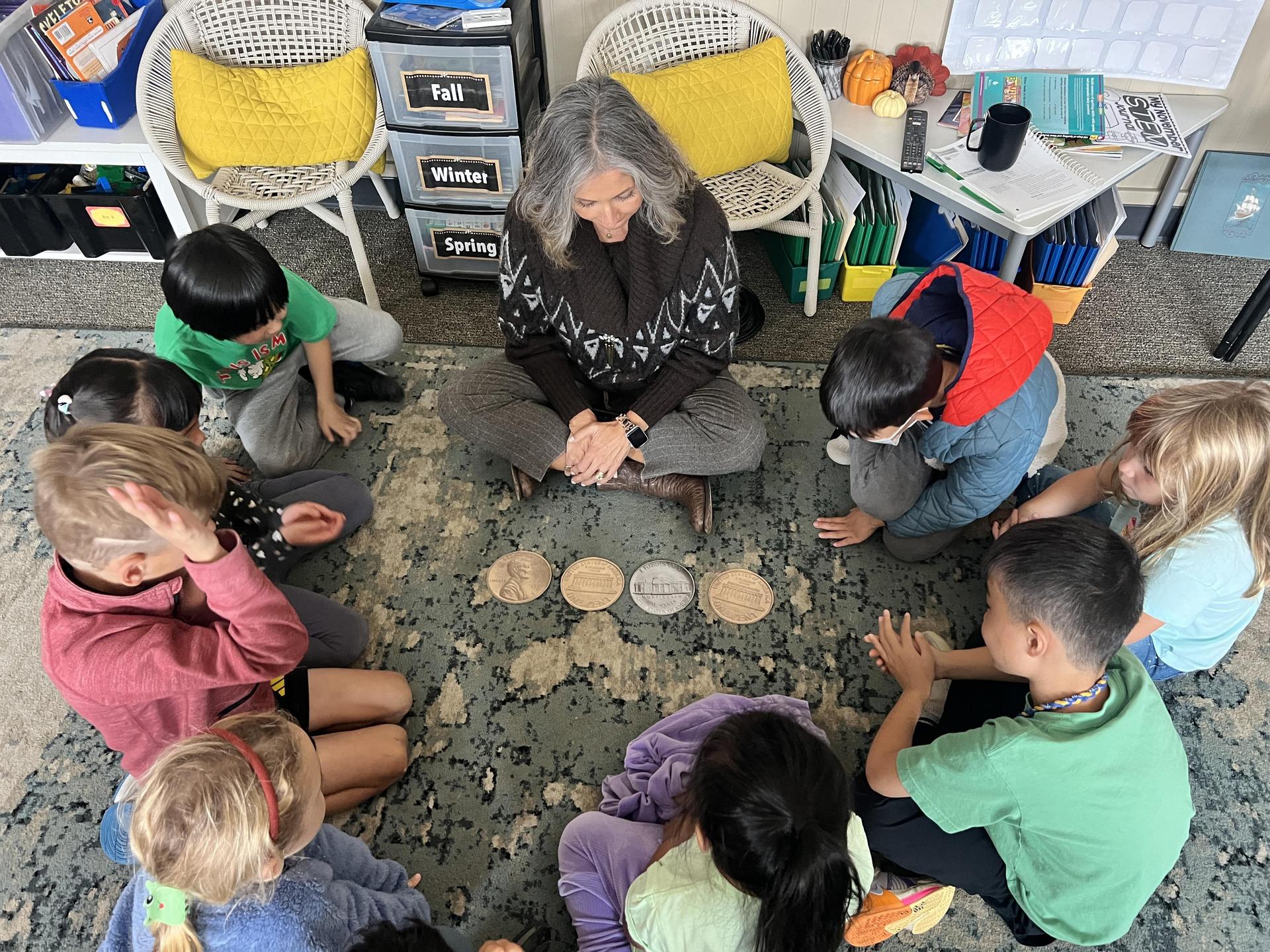 Teacher sitting with small group
