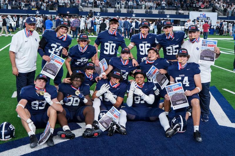 Members of the 2025 Smithson Valley High School football team with championship medals