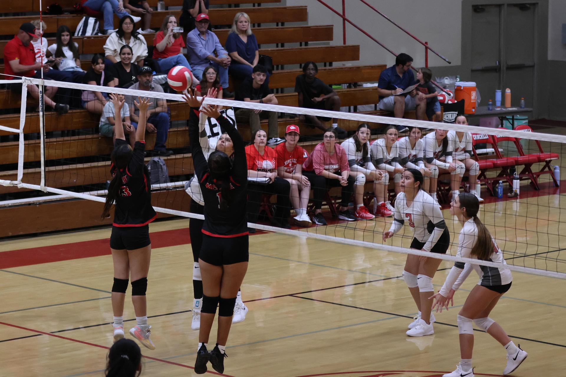 junior varsity girls playing volleyball 127