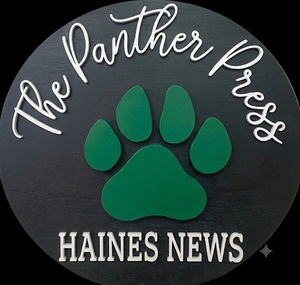 The Panther Press with a green paw print