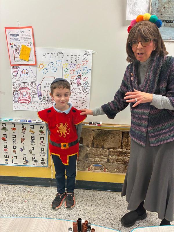 A boy shows his costume