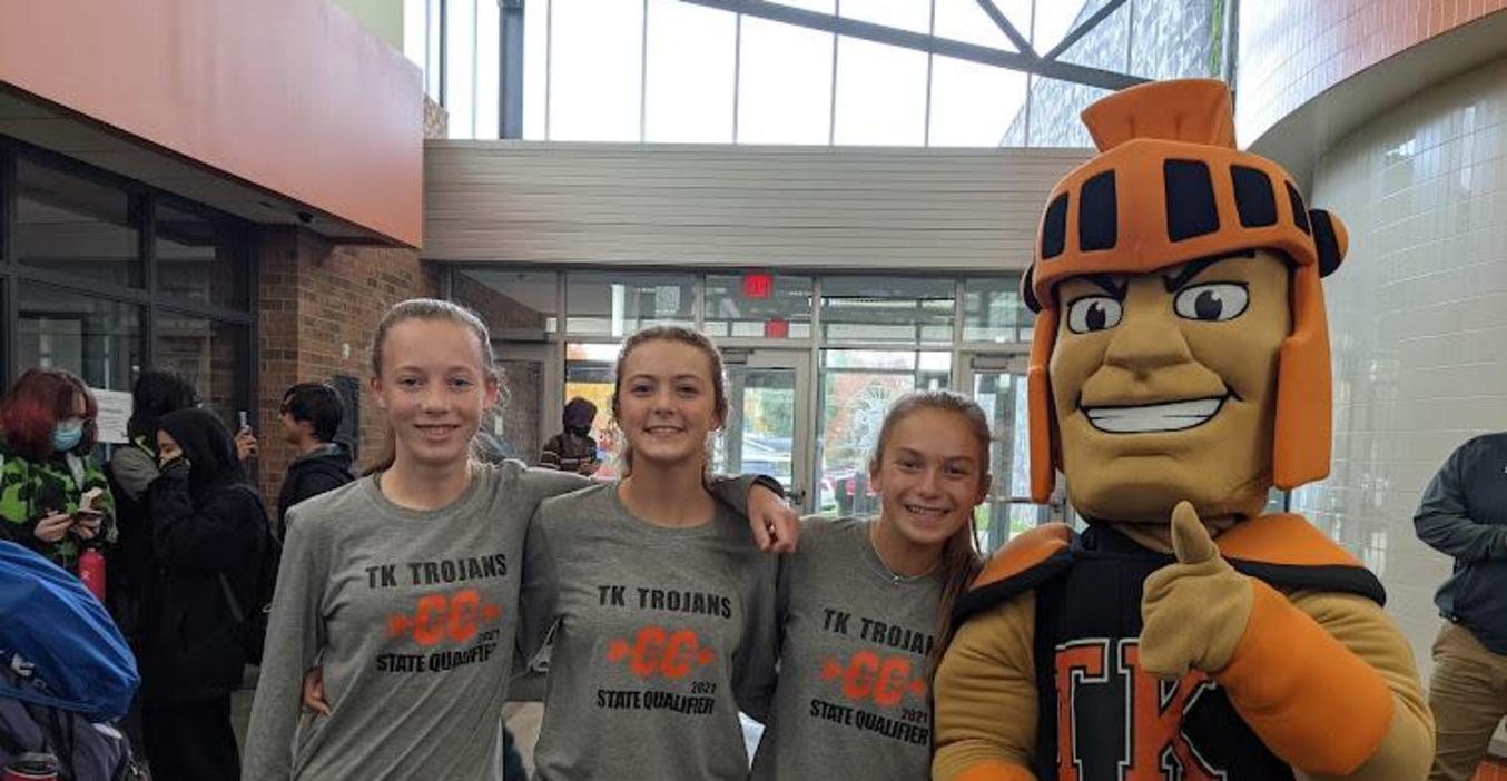 Three cross country runners are honored as they get ready to compete at the state.