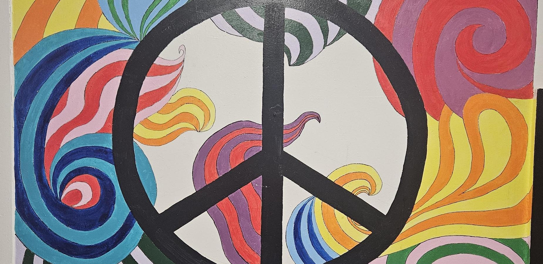 Colorful abstract artwork featuring a large peace symbol surrounded by swirling patterns.