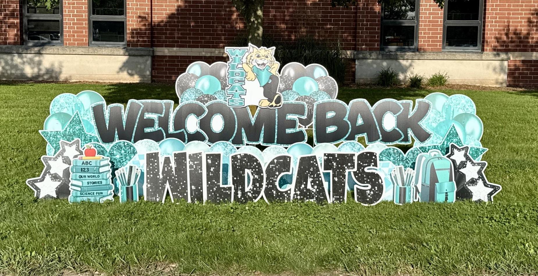 Welcome Back Wildcats signage in front of the school.