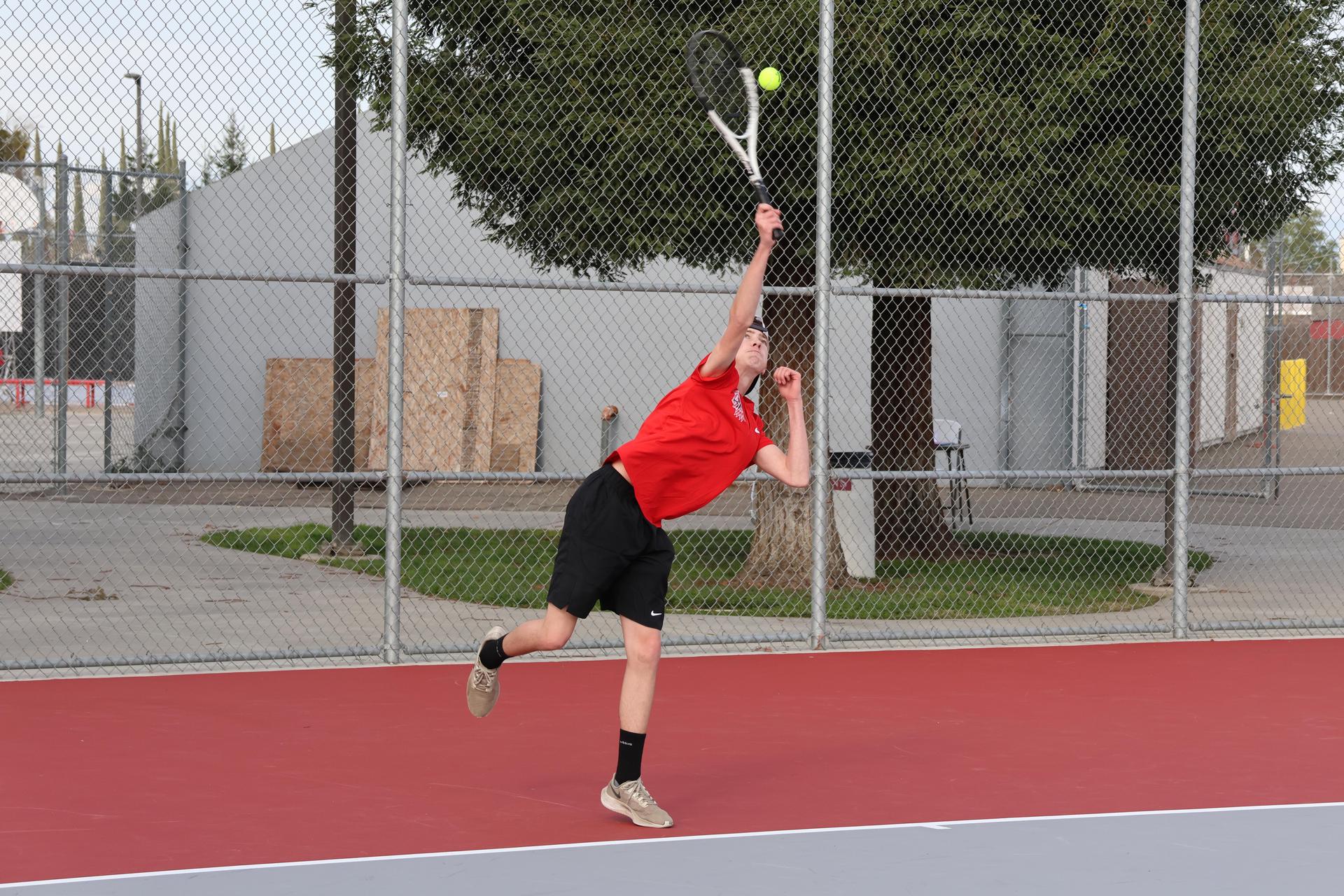 CUHS Boys playing tennis against coalinga