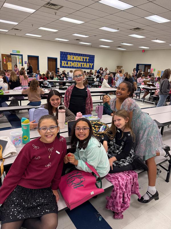 A group of elementary students gathered around a table at the Elementary UIL Competition.