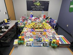 School supplies fill a table at the Angelo School