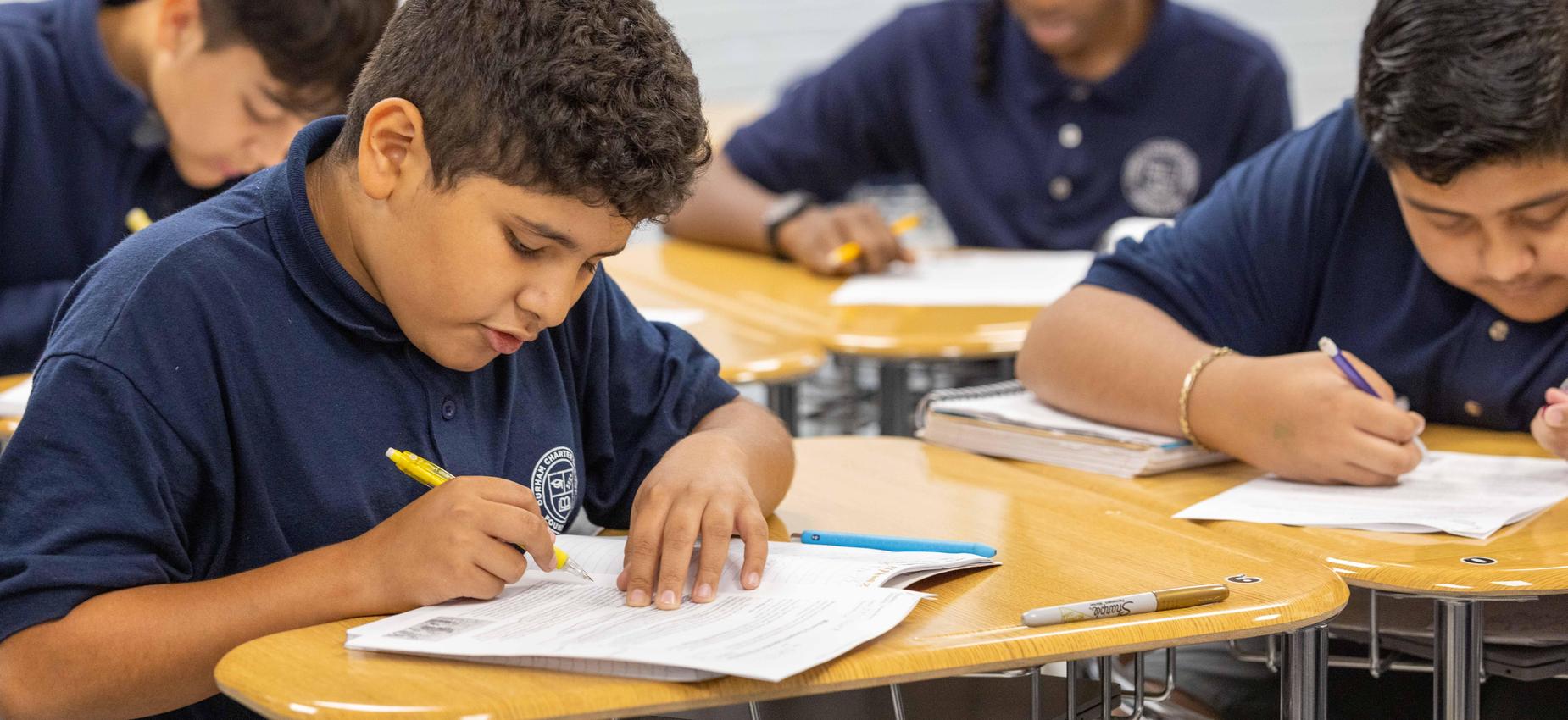 Scholars at work, writing and reading.
