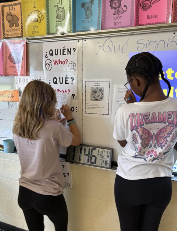 Students decode sentences in Spanish about different cultures.
