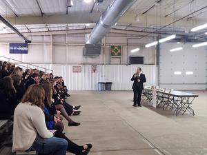 Guest presenter speaking at DLC in front of entire FFA Group.