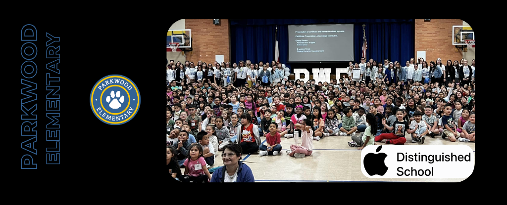 A large group photo of Parkwood Elementary students and staff in a gymnasium setting.