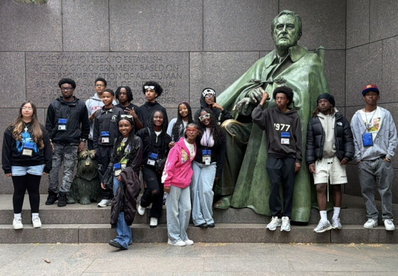 8th graders in front of statue