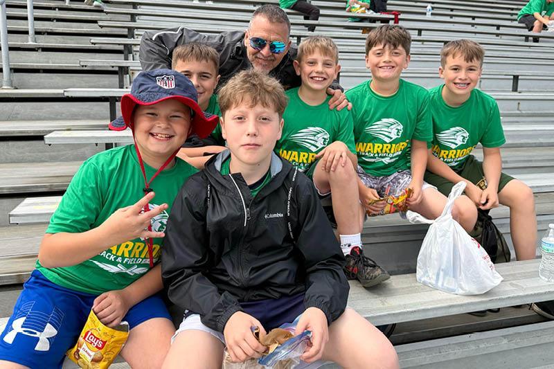 Harrison Park Elementary students Dominic Pellegrino, Camden Schwer, Nolan Thomas, Beckham Haywood, Cruz Kamensky, and Kaden Henkel take a break for lunch with their teacher, Mr. Larry Hohman