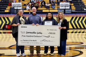 Samantha Salas accepting the Teacher of the Month award for November