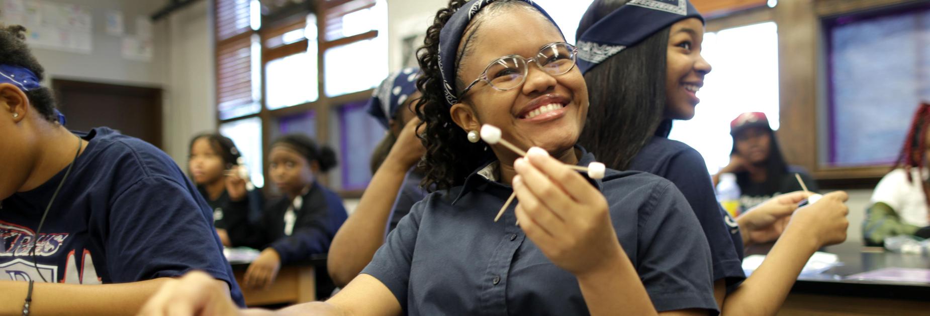 A female KRHS student working on a science project
