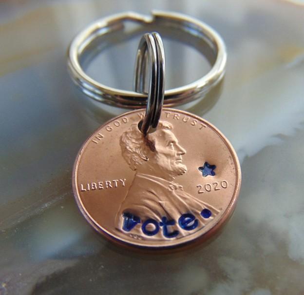 penny with vote on it