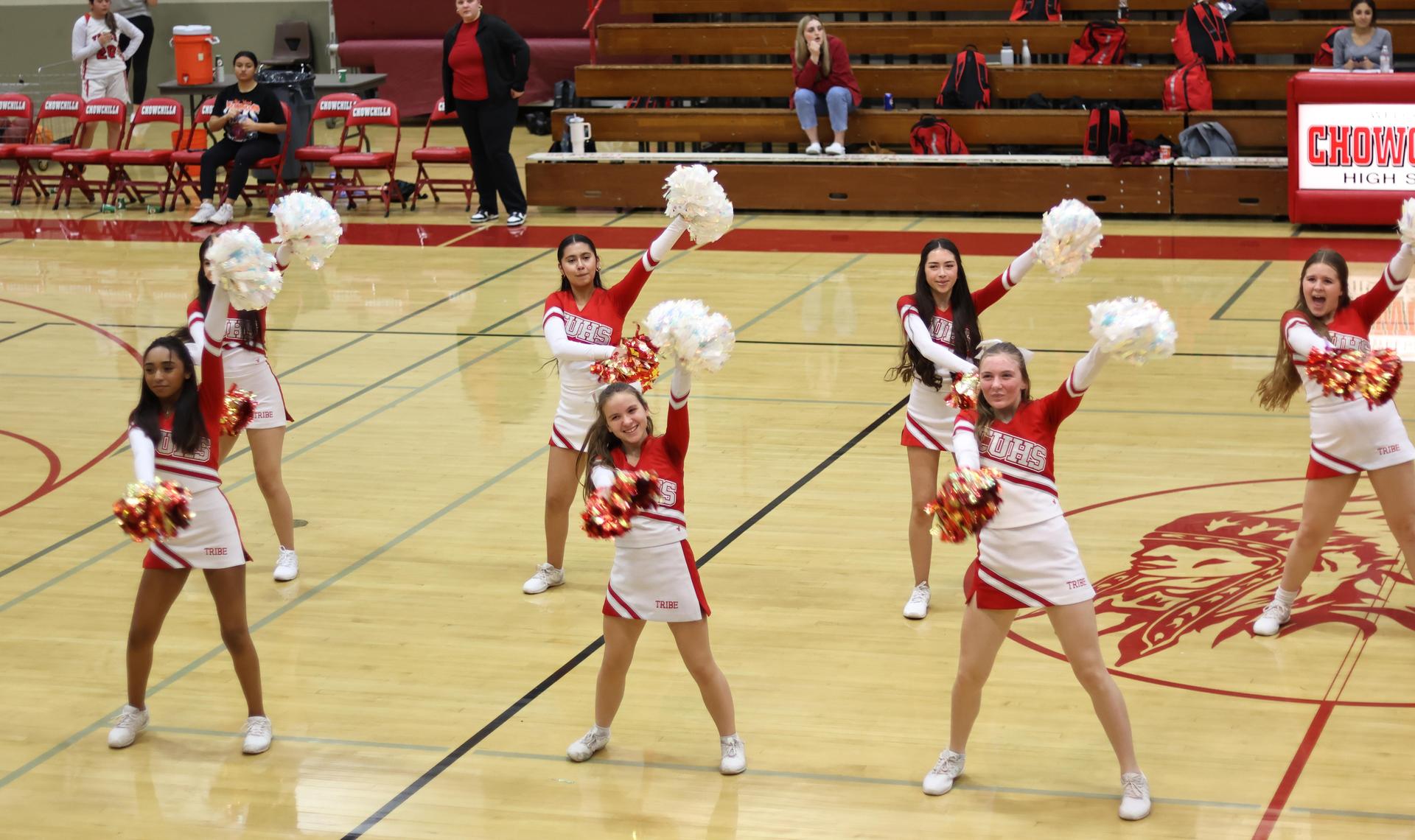 junior varsity cheerleaders cheering