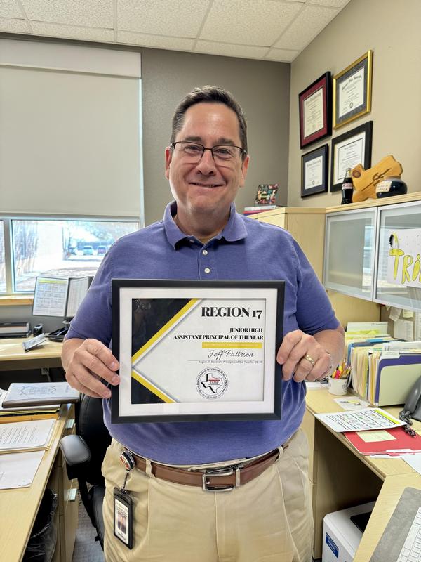 Jeff Patterson holding his TASSP-Region 17 certificate