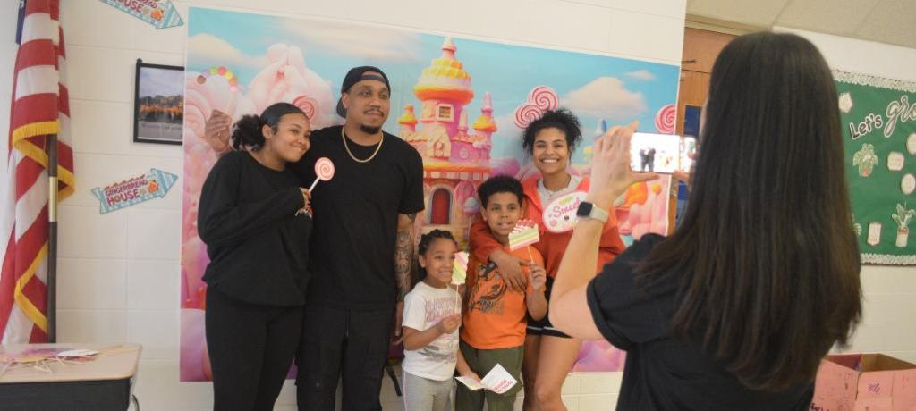 teacher takes photo of family